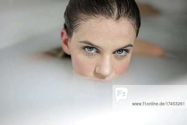 beautiful young woman in bathtub
