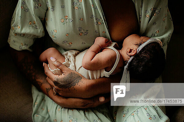 Mixed baby nursing on her black mother.