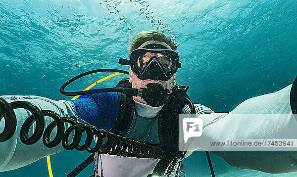 diver taking selfie in the tropical waters around Phuket