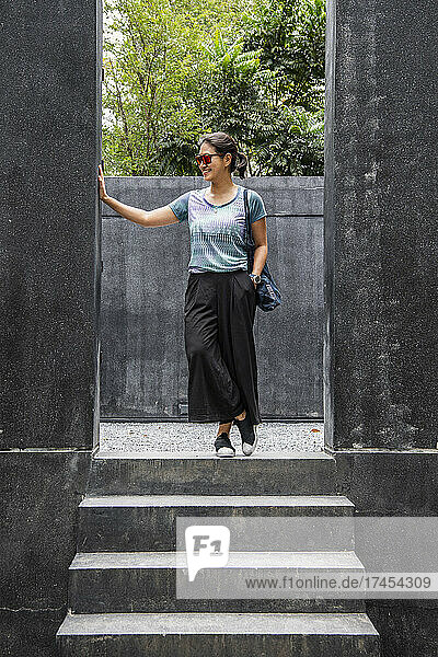 beautiful woman standing in doorway at Khao Yai national park