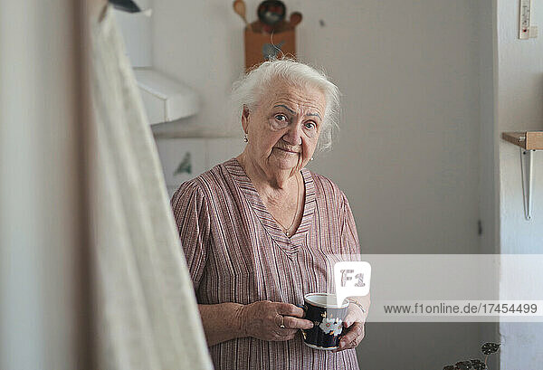portrait of elderly lady in her kitchen