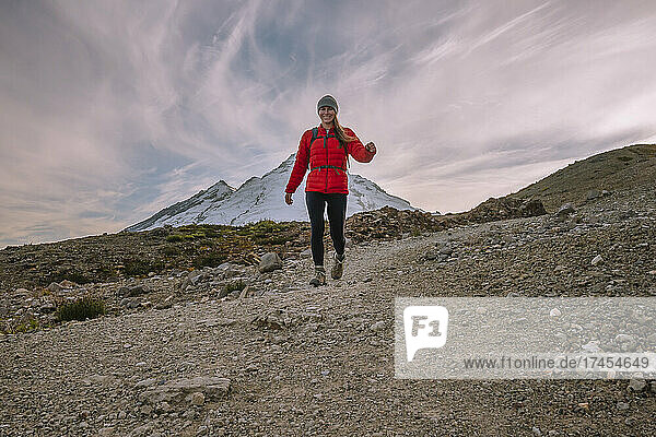 Female In Tights and Red Puffy Coat Hiking In The North Cascades