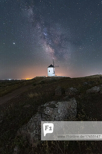 Milky way on old windmill nightscape with stars