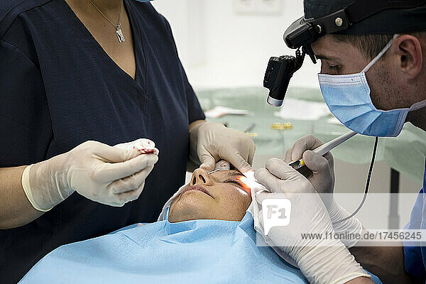 Plastic surgery operation  modifying the eye region in medical clinic