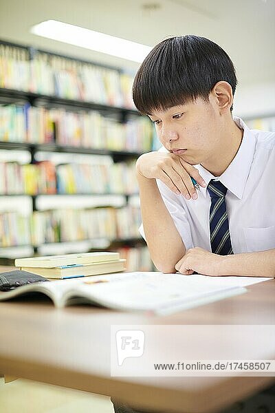 Japanese school student in the library