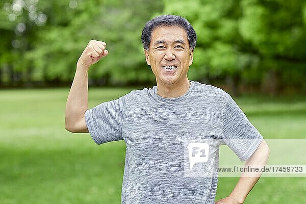 Japanese senior man training at a city park