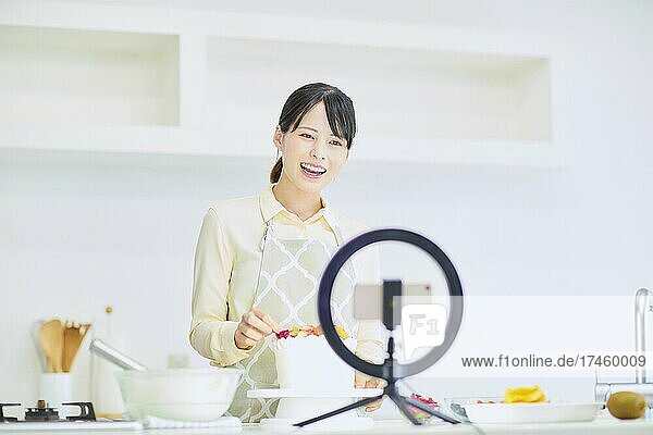 Japanese woman making cake in the kitchen
