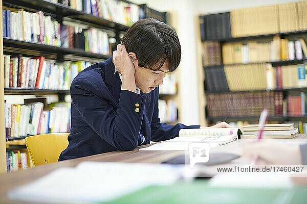 Japanese school student in the library