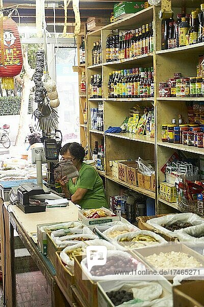 Small shop with bottles and canned goods on the shelf  Shanghai  China  Asia