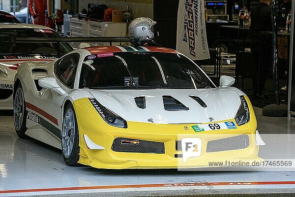 Ferrari 488 Challenge stands in pit box in pit lane  in front of it red line with lettering Pit Lane  Circuit de Spa-Francorchamps  Stavelot  Belgium  Europe