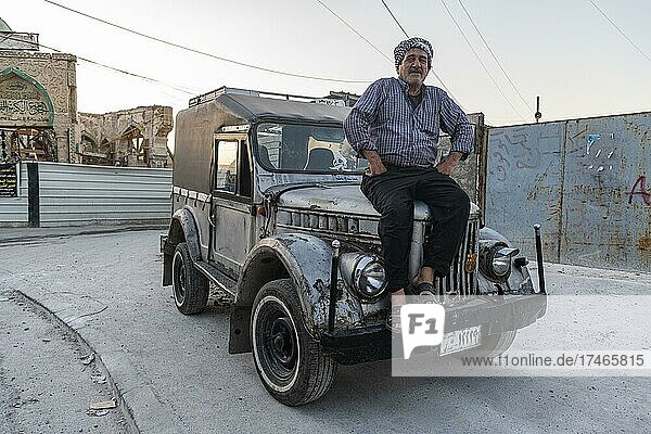 Man on his old russian jeep  Mosul  Iraq  Asia