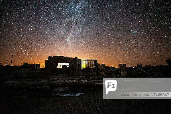 View of abandoned wall and gate against milky way in sky  Villa Epecuen