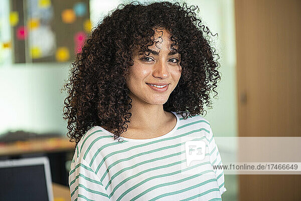 Portrait of smiling beautiful businesswoman in office
