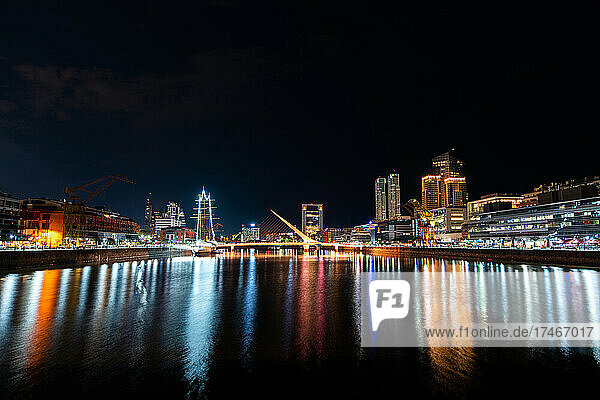 View of Puente de la Mujer and Puerto Madero waterfront at night
