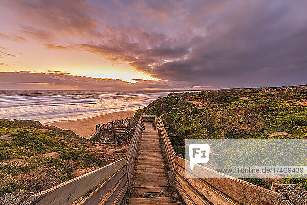 Woolamai Surf Beach boardwalk at moody sunset