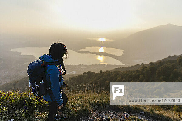 Backpacker looking at sunset