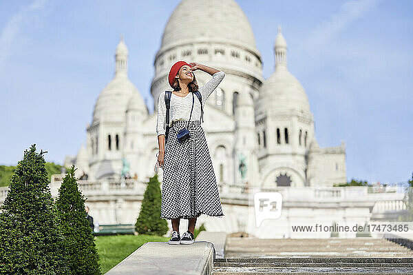 Young female tourist with beret at Basilique Du Sacre Coeur  Montmartre in Paris  France