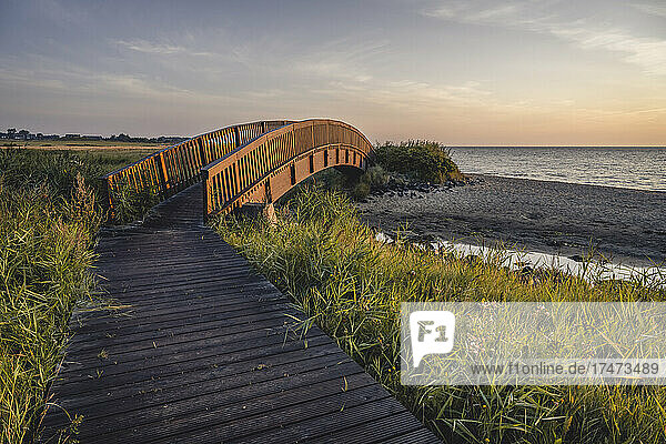 Coastal boardwalk and Lugenbrucke bridge at dusk