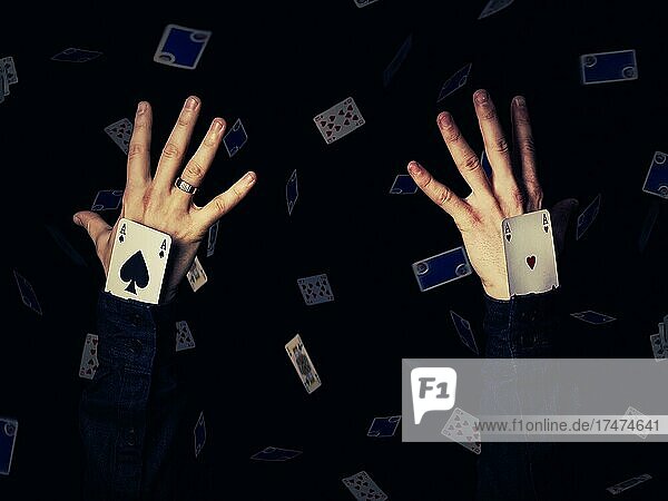 zwei Hände  die Asse im Ärmel halten. Magier zeigt Trick  schwarzer Hintergrund mit fallenden Karten  Casino Spiel  gewinnen Konzept