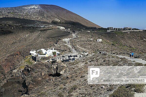 Hikers hike along the crater hiking trail  Santorini  Cyclades  Greece  Europe