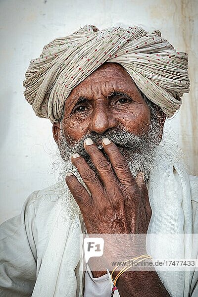 Elderly Indian man resting on a bed  Jaisalmer  Rajasthan  India  Asia