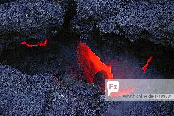 Magma glows under cooled lava  Fagradalsfjall  volcano  Grindavik  Reykjanes  Iceland  Europe