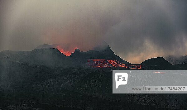 Erupting volcano with lava fountains and lava field  crater with erupting lava and lava flow  Fagradalsfjall  Krýsuvík volcano system  Reykjanes Peninsula  Iceland  Europe
