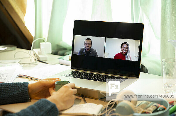 Business people video chatting from home on laptop screen