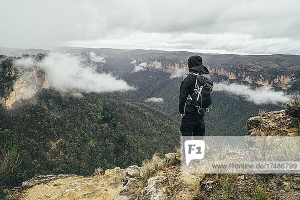 Male hiker on remote mountaintop  Australia