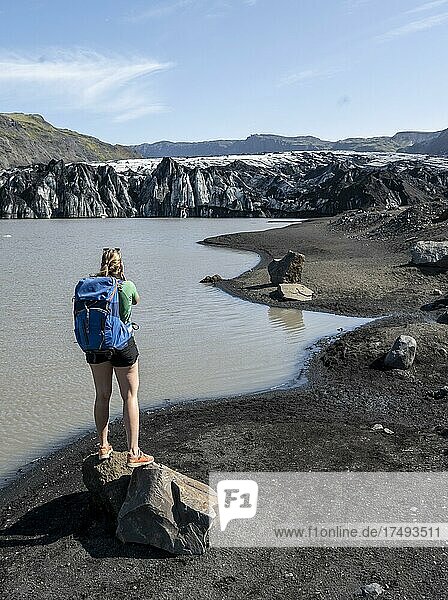 Hiker in front of Sólheimajökull glacier tongue on Mýrdalsjökull glacier  Suðurland  Iceland  Europe