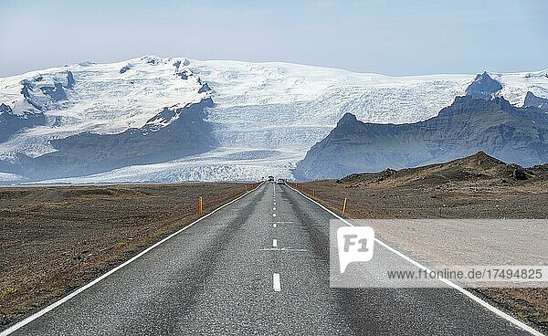 Country road  huge Vatnajökull glacier in the back  Ring Road  Iceland  Europe