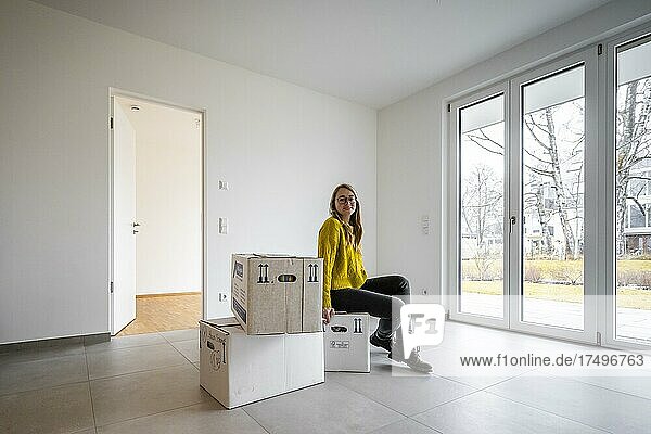 Young woman moves into an empty flat  flat move  Germany  Europe