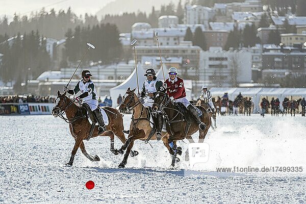Robert Strom (red) of Team St. Moritz and Pato Bolanteiro (white) of Team Azerbaijan Land of Fire fight for the ball  36th Snow Polo World Cup St. Moritz 2020  Lake St. Moritz  St. Moritz  Grisons  Switzerland  Europe