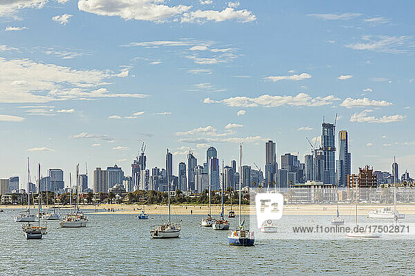 Australia  Victoria  Melbourne  Yachts floating against city skyline in summer