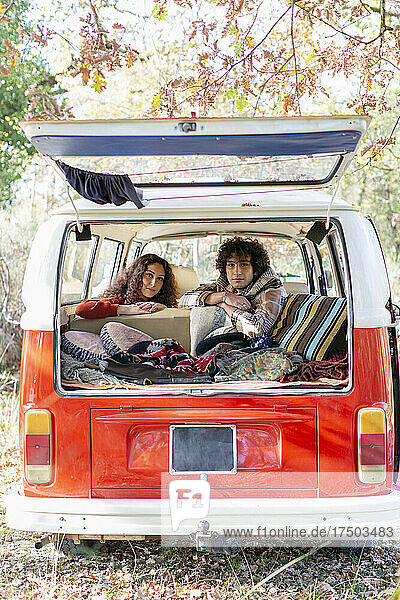 Couple spending weekend in campervan