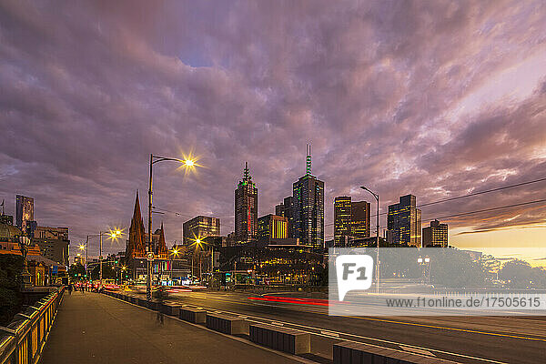Australia  Melbourne  Victoria  Cloudy sky over Saint Kilda Road at dusk