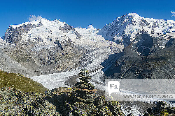 Scenic view of Gorner Glacier with cairn in foreground