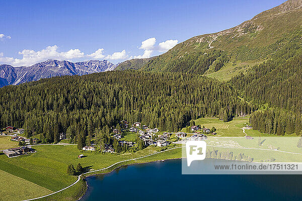 Switzerland  Canton of Grisons  Davos  Aerial view of villas on shore of Lake Davos in summer