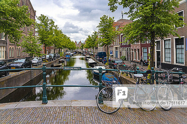 Netherlands  North Holland  Haarlem  Bicycles parked along railing of canal bridge