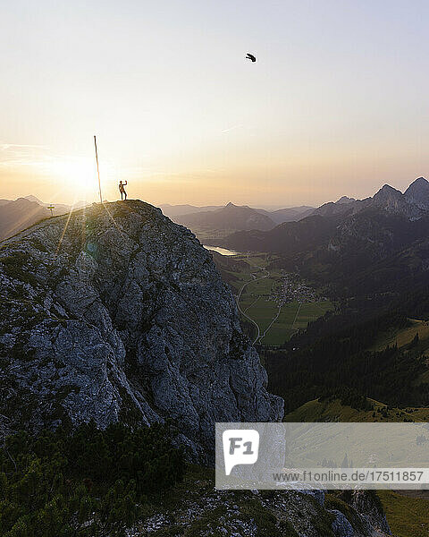 Hiker on viewpoint during sunset  Gaichtspitze  Tyrol  Austria