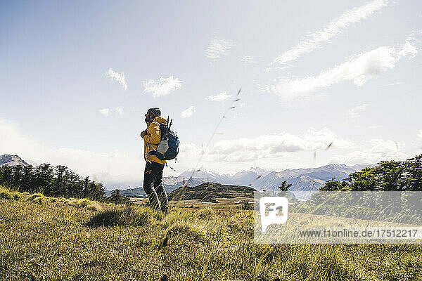 Man with backpack standing on mountain in Patagonia  Argentina  South America