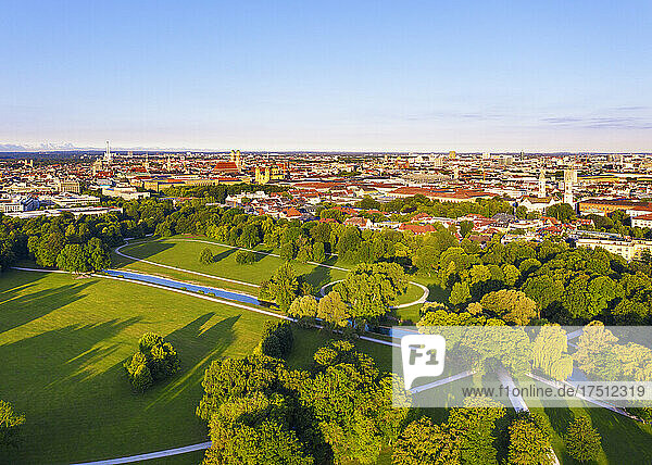 Germany  Bavaria  Munich  Aerial view of clear sky over Schwabinger Bach stream flowing through English Garden at dusk