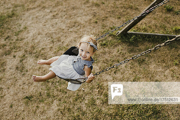 Cute little girl on a swing