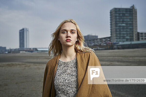 Netherlands  Zandvoort  portrait of blond young woman on the beach