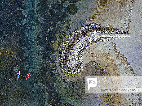 Indonesia  Bali  Sanur  Aerial view of kayakers in front of coastal retaining wall