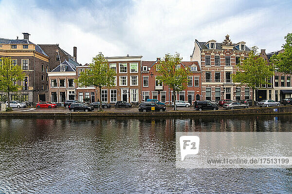 Netherlands  North Holland  Haarlem  Parked cars and historic houses along Binnen Sparne canal