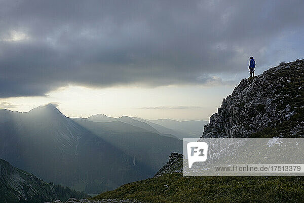 Hiker on viewpoint in the evening  Sulzspitze  Tyrol  Austria