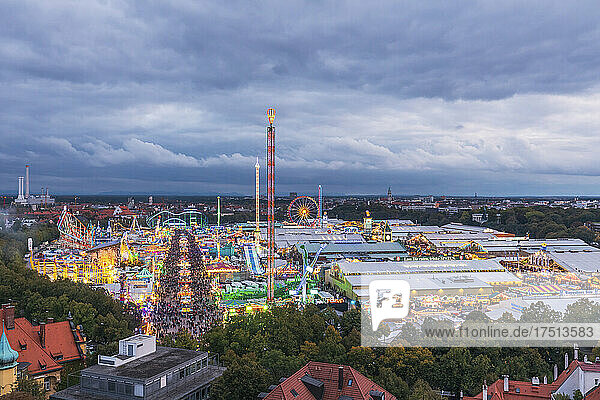 Germany  Bavaria  Munich  Drone view of clouds over crowded amusement park during Oktoberfest
