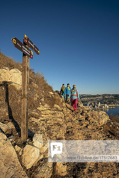 A group of friends hiking on the mountain  Calpe  Alicante  Spain
