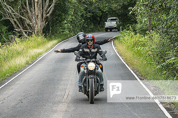 couple enjoying a motorcycle ride in the Khao Yai national park